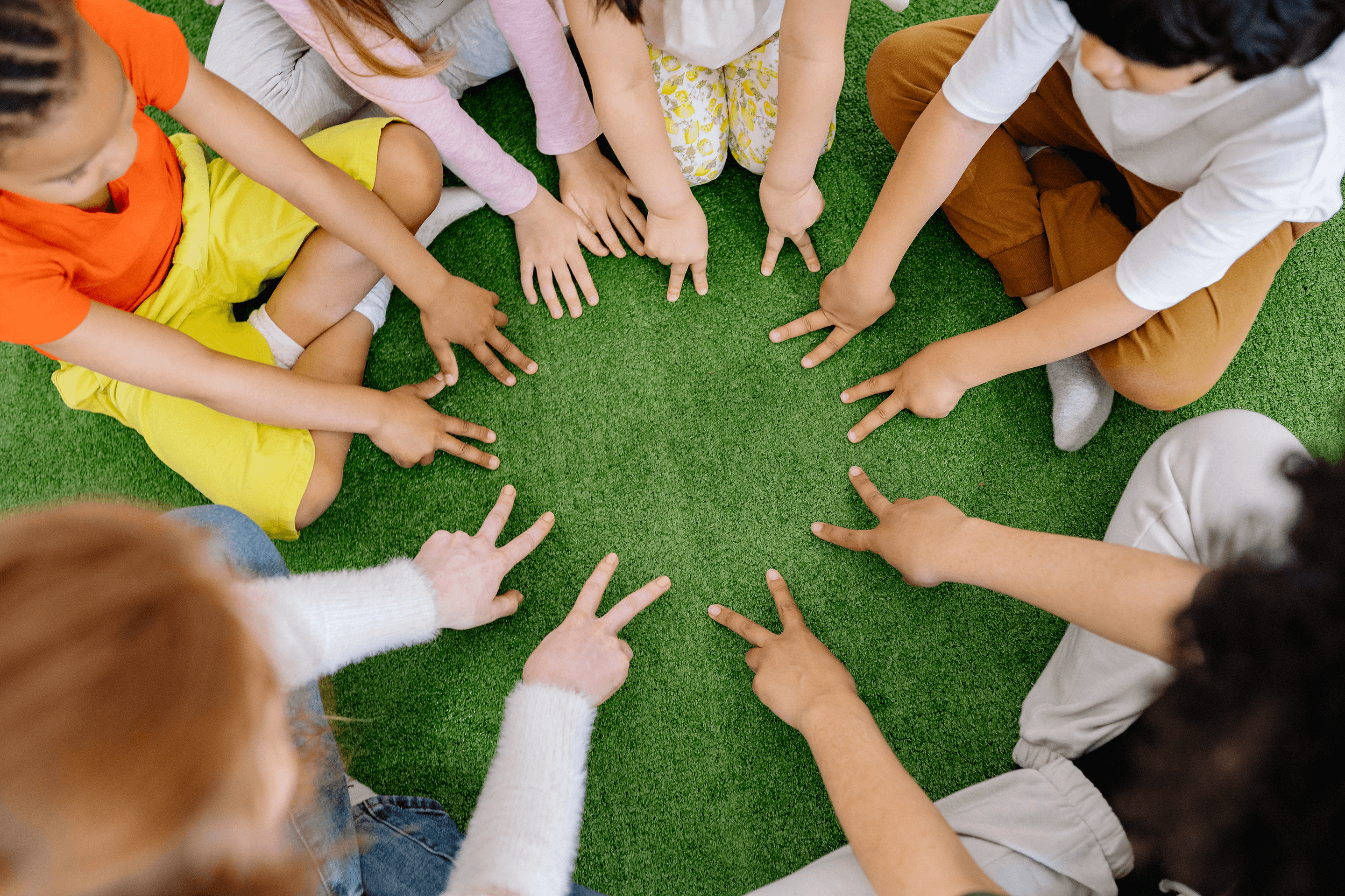 Group of children with developmental needs sitting in a circle